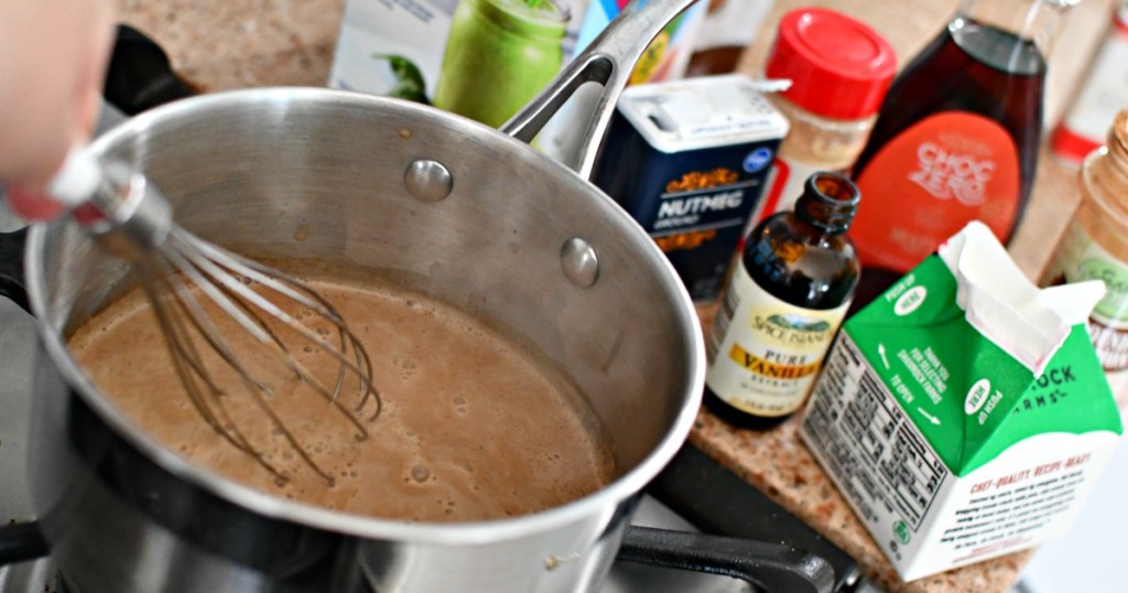 whisking gingerbread latte on the stove