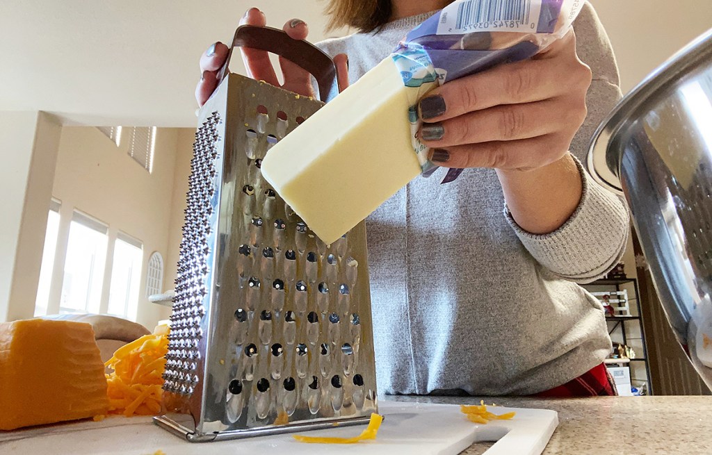 woman grating cheese