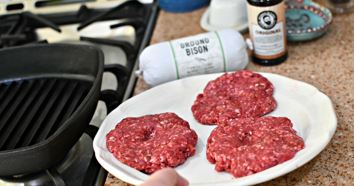 raw burgers on a plate 