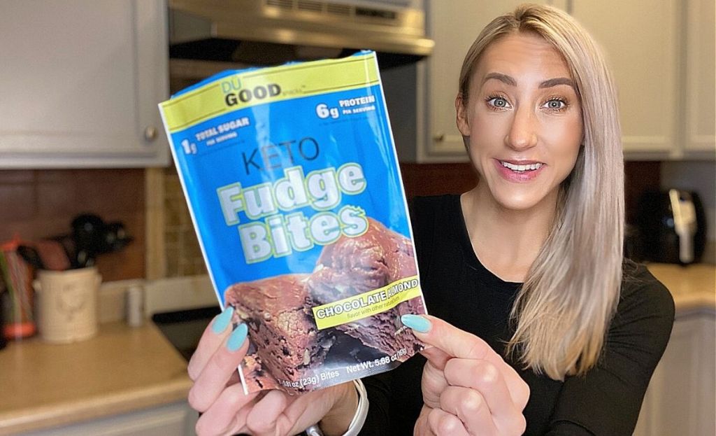 A woman holding a bag of keto fudge bites