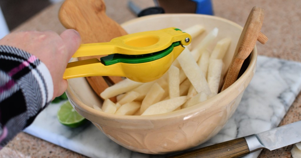 adding lime juice to jicama