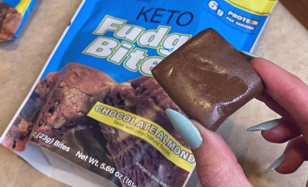 A hand holding a keto fudge bite