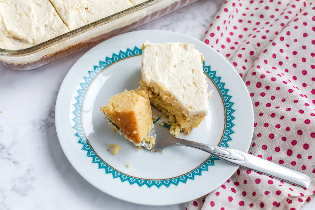 slice of keto birthday cake with frosting on plate 