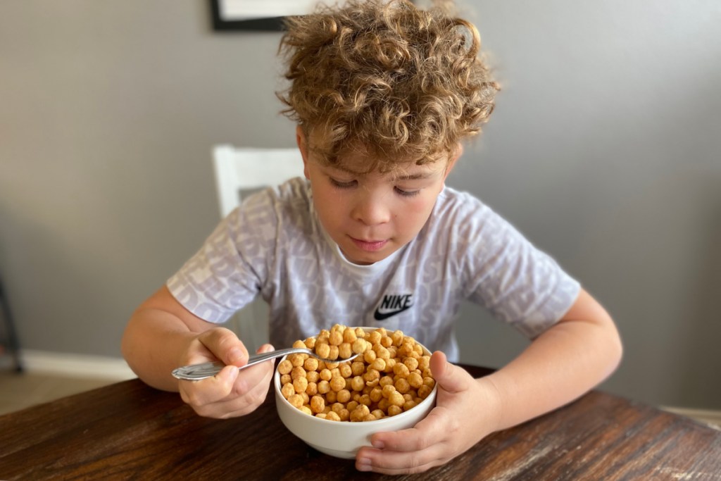 boy eating keto friendly cereal at the table