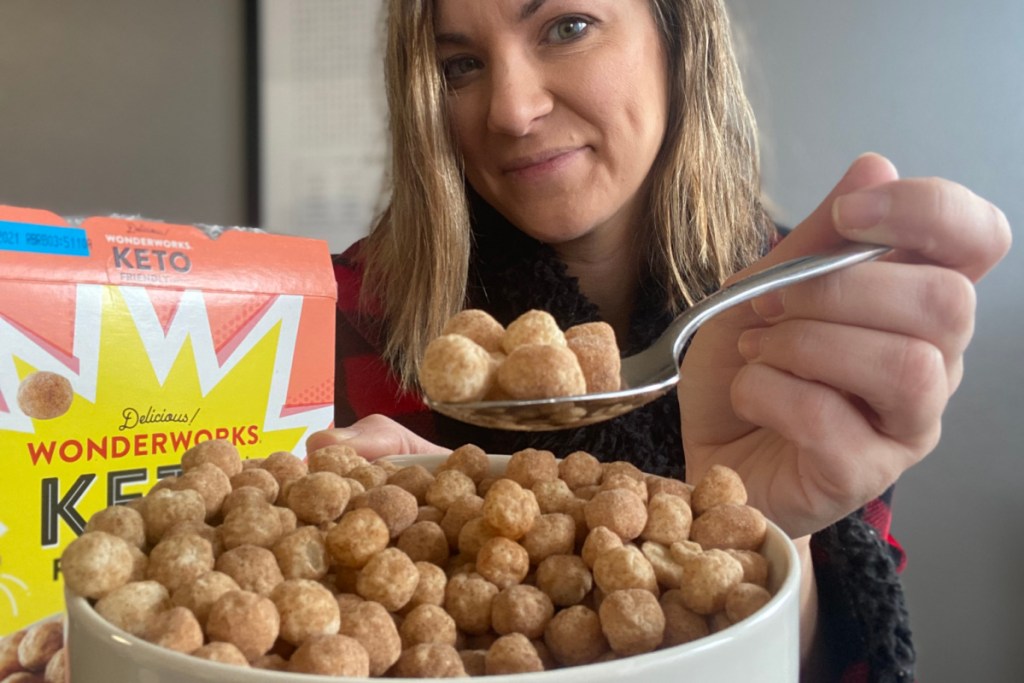 girl holding a bowl of keto cereal