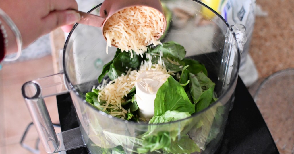 adding parmesan to food processor 