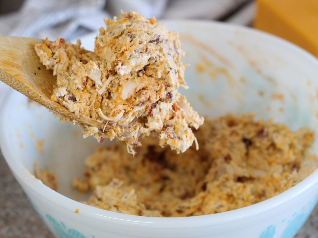 mixing buffalo chicken fat bombs in mixing bowl