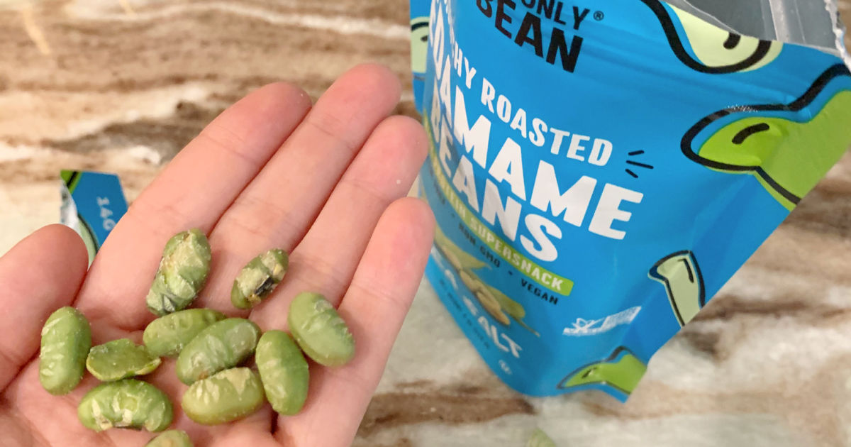 holding a handful of crunchy edamame beans