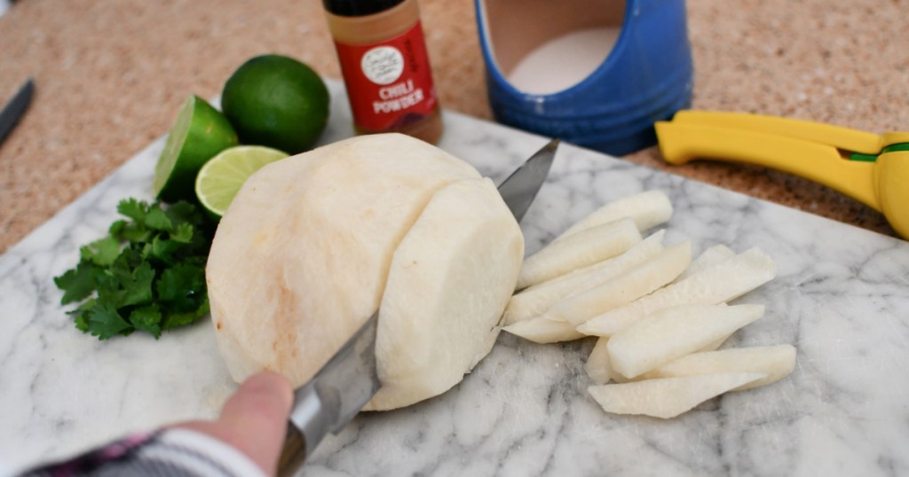 cutting into jicama