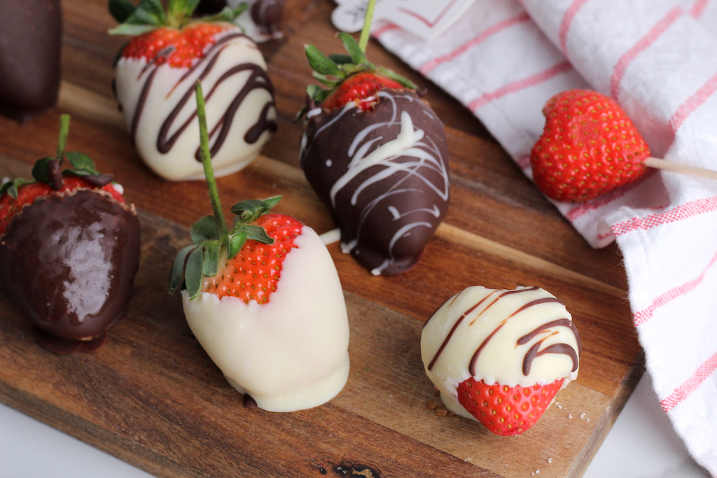 keto chocolate covered strawberries on cutting board 
