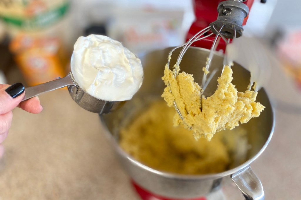 adding sour cream to mixer