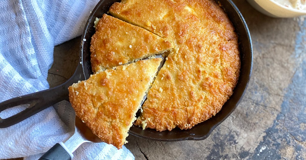 keto cornbread slice in a cast iron skillet