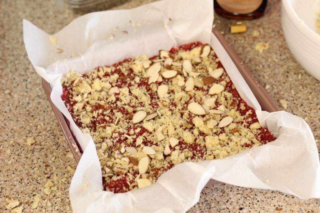 keto raspberry bars in a baking pan