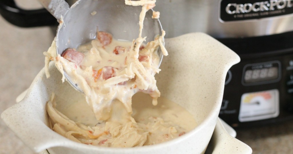 putting keto white chicken chili in bowl 