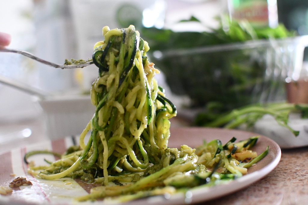 zoodles with pesto on fork