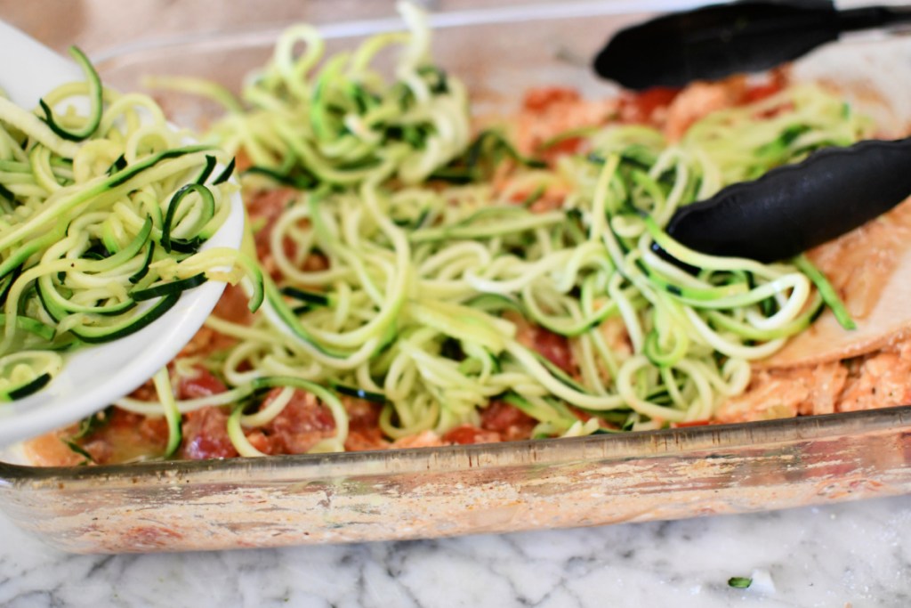 adding zoodles to pasta