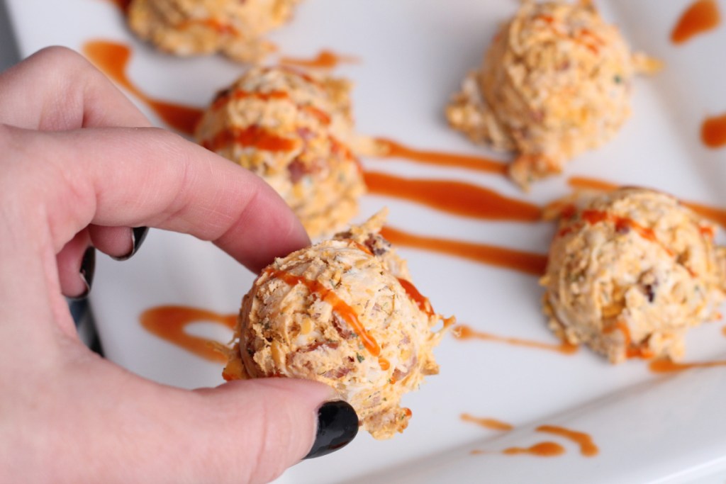 woman holding buffalo chicken fat bomb