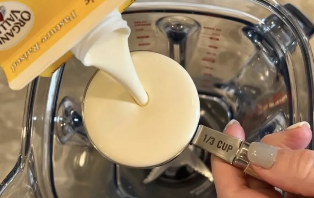 pouring heavy cream in blender