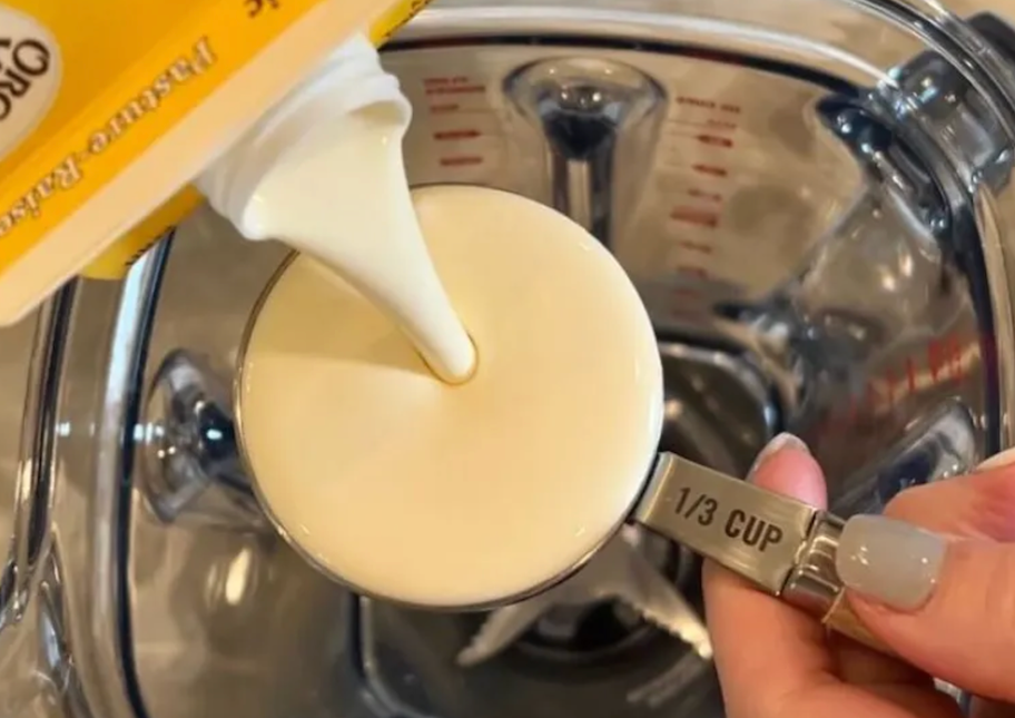 pouring heavy cream in blender