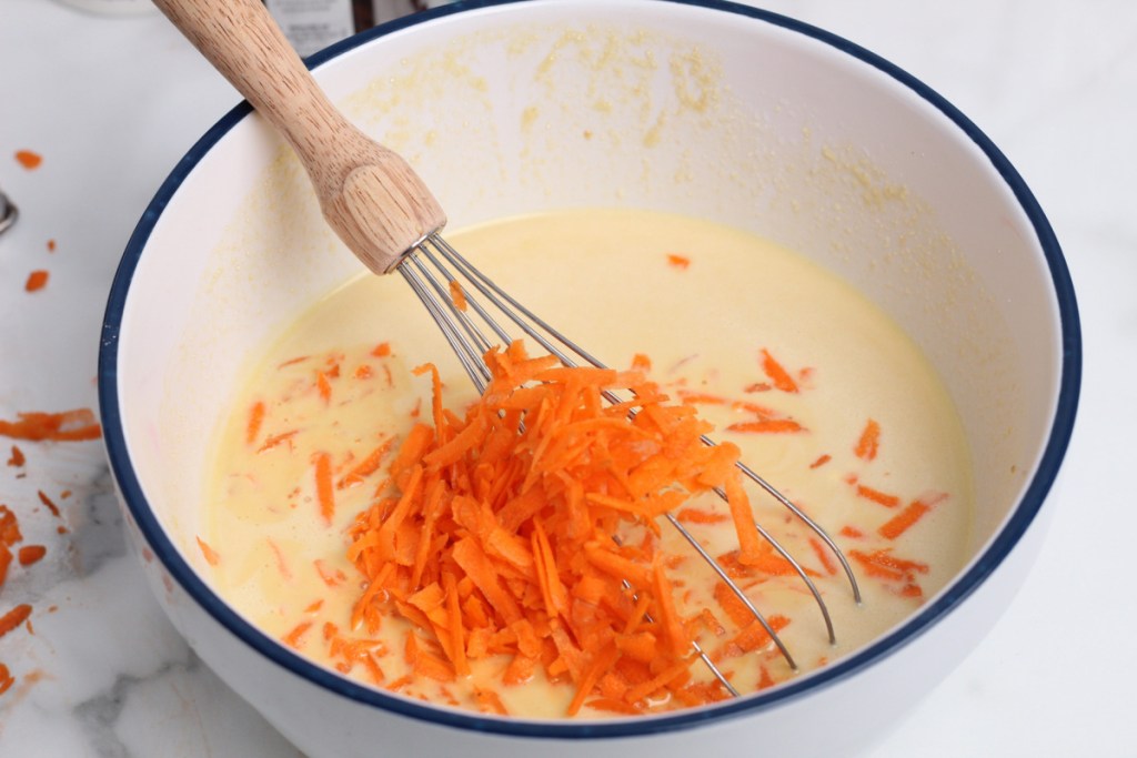 shredded carrots added to mixing bowl