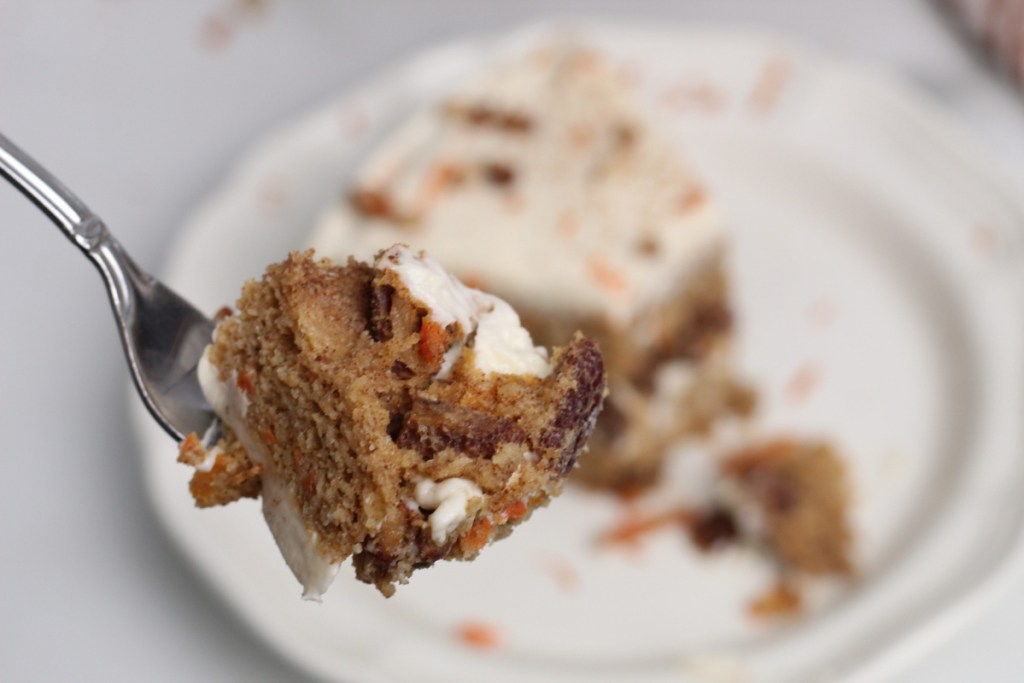 fork with a bite of keto carrot cake on it