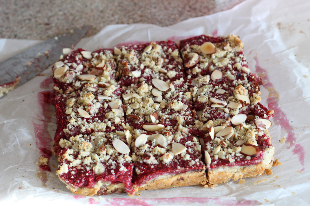 keto raspberry bars sliced into squares 