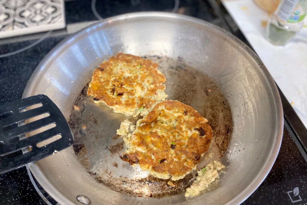salmon patty in a skillet