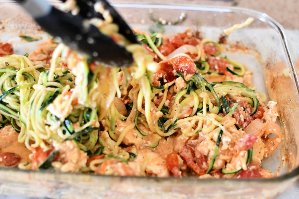mixing baked feta with zoodles