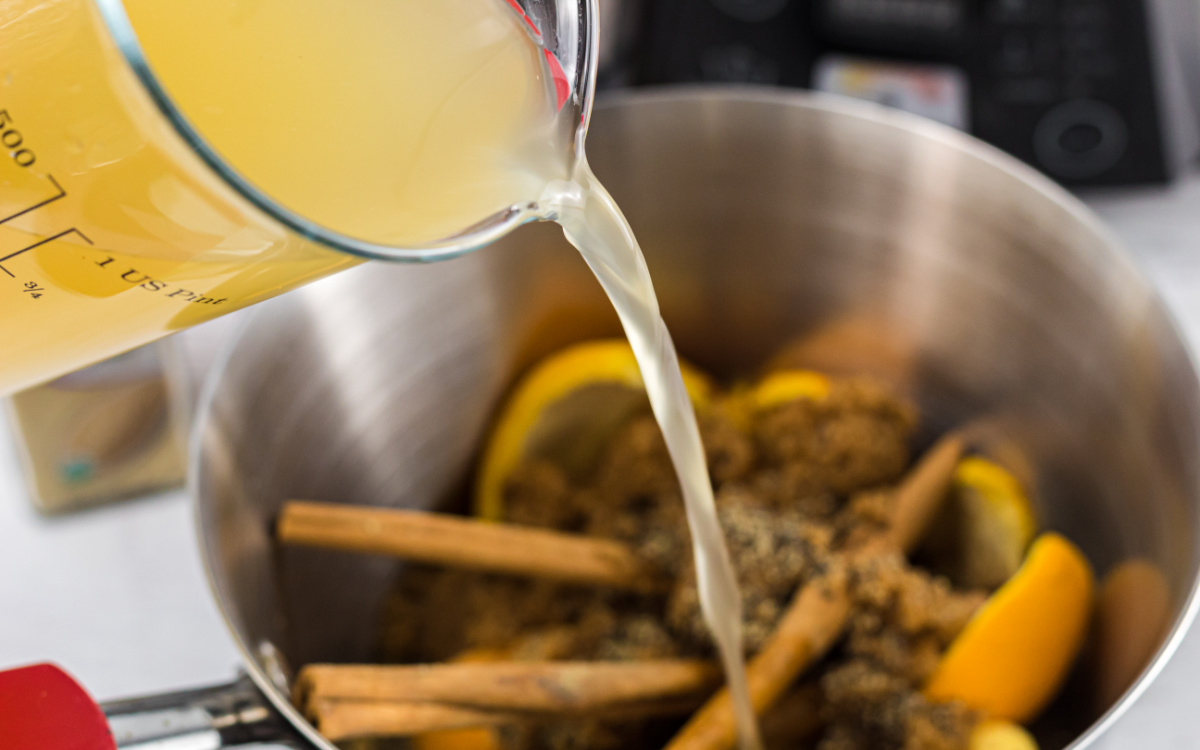 pouring broth into sauce pan for keto glaze