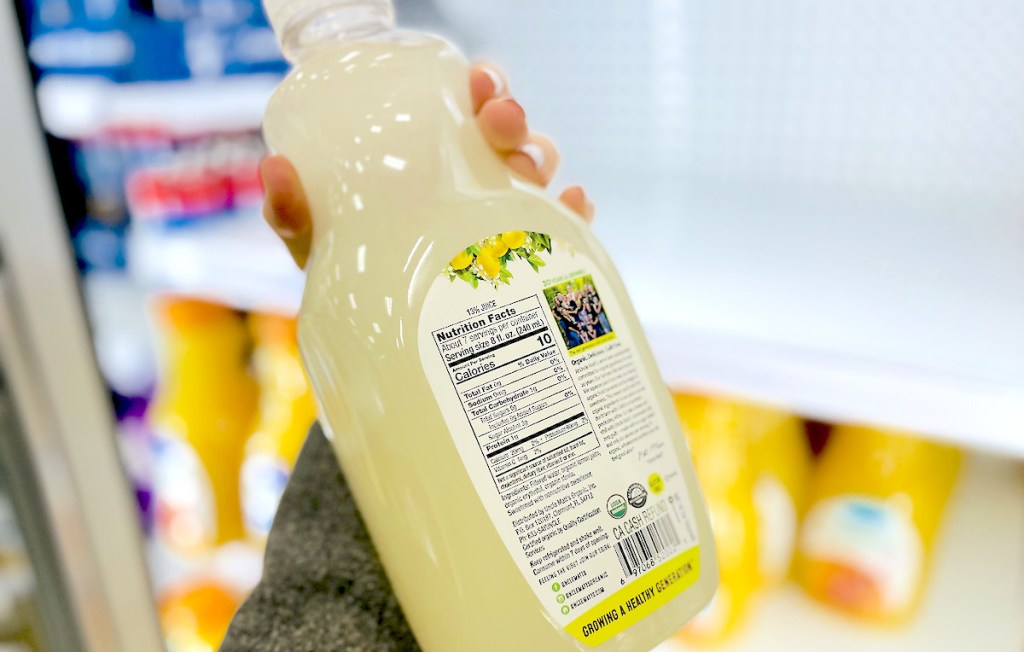 hand holding bottle of sugar free lemonade showing nutrition label 