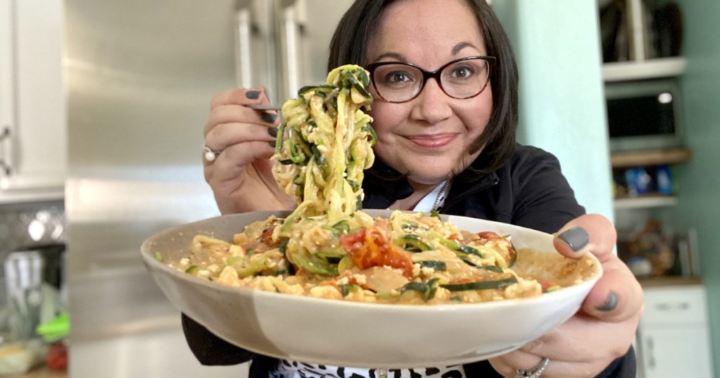 woman eating keto baked feta tomato pasta