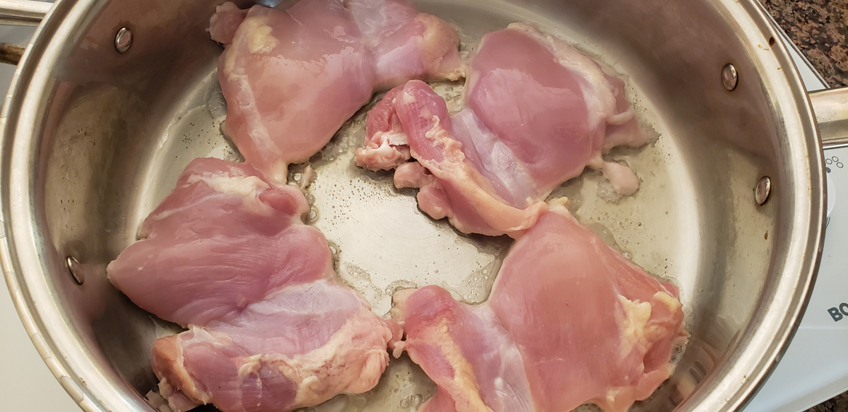 Raw chicken in the pan