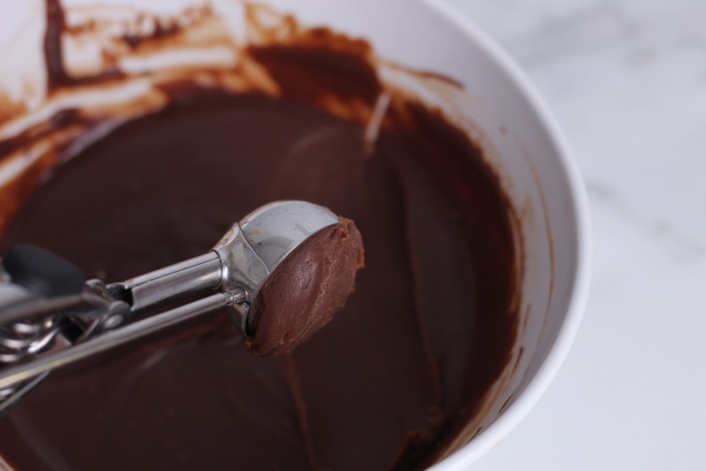 scooping out keto chocolate truffles