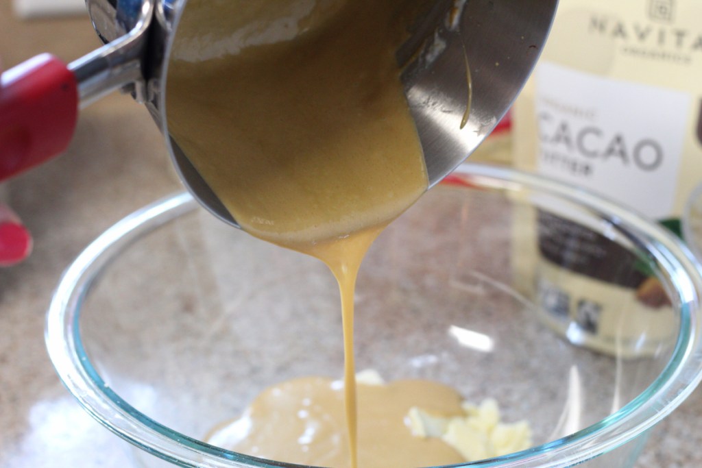 pouring melted cream cheese into bowl