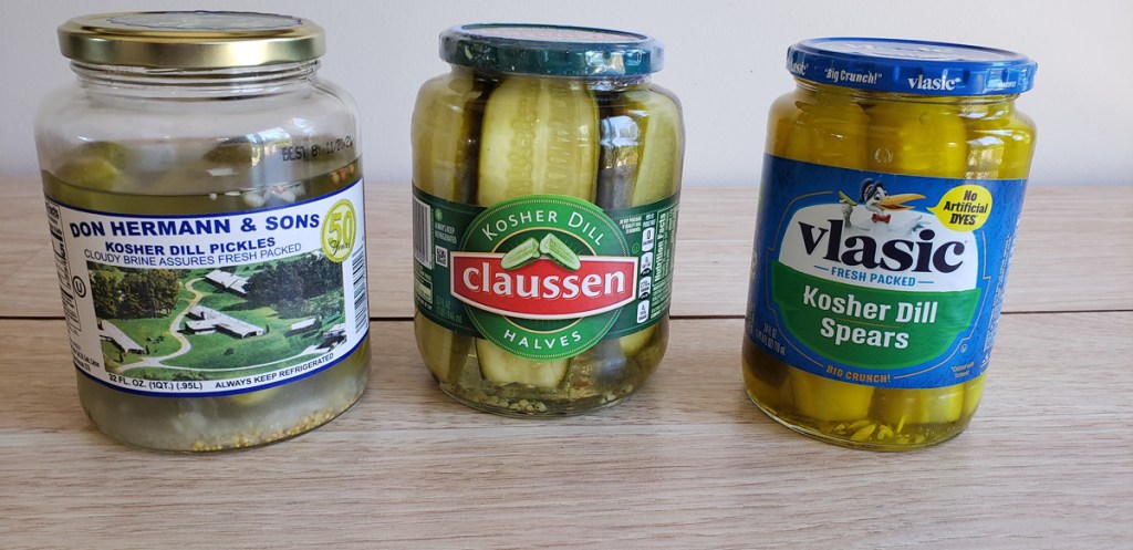 3 jars of pickles on counter