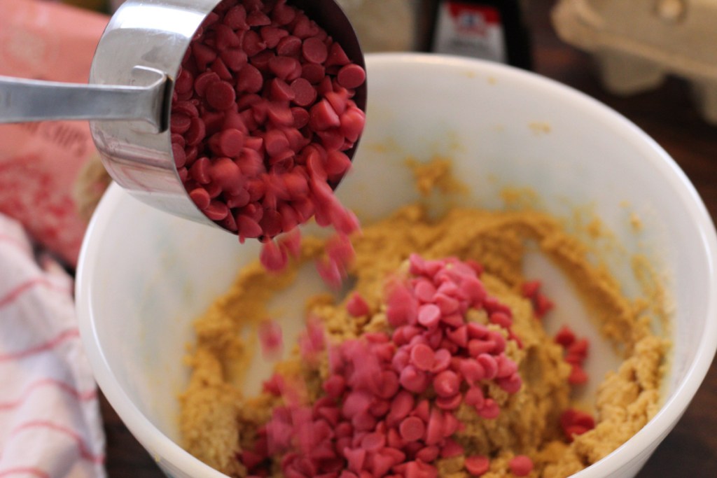 well adding chocolate chips to mixing bowl