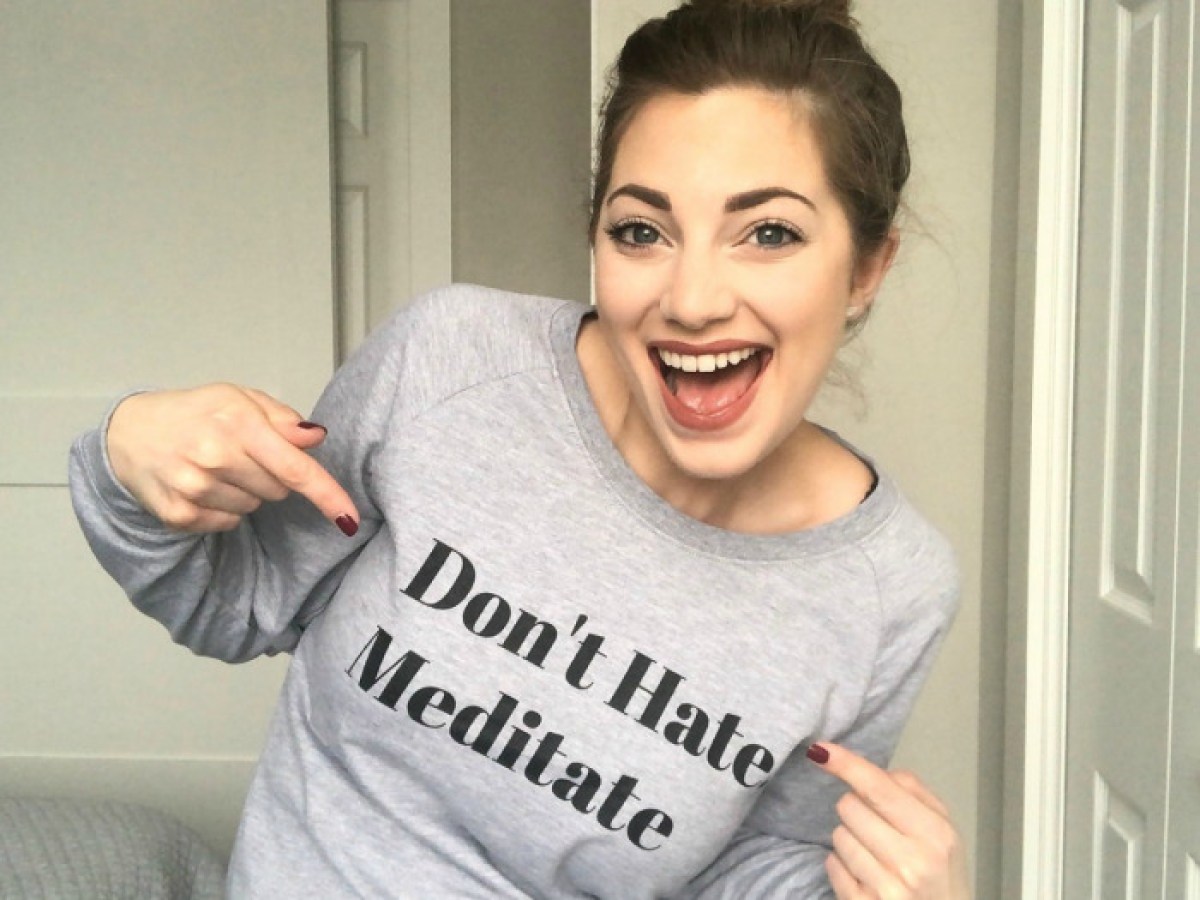 woman pointing to words on T-shirt