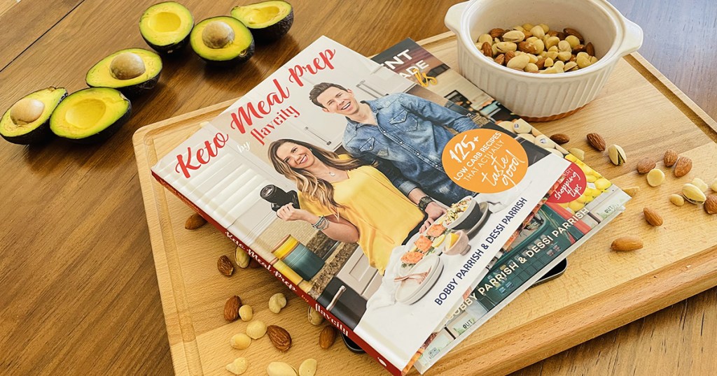 FlavCity keto meal prep cookbook on cutting board