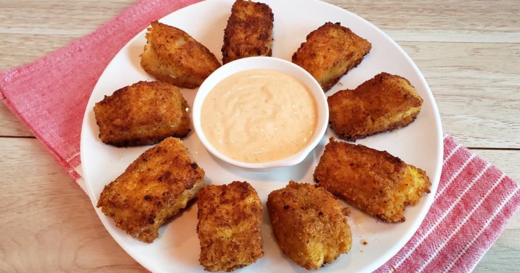keto fried fish on plate with dipping sauce 