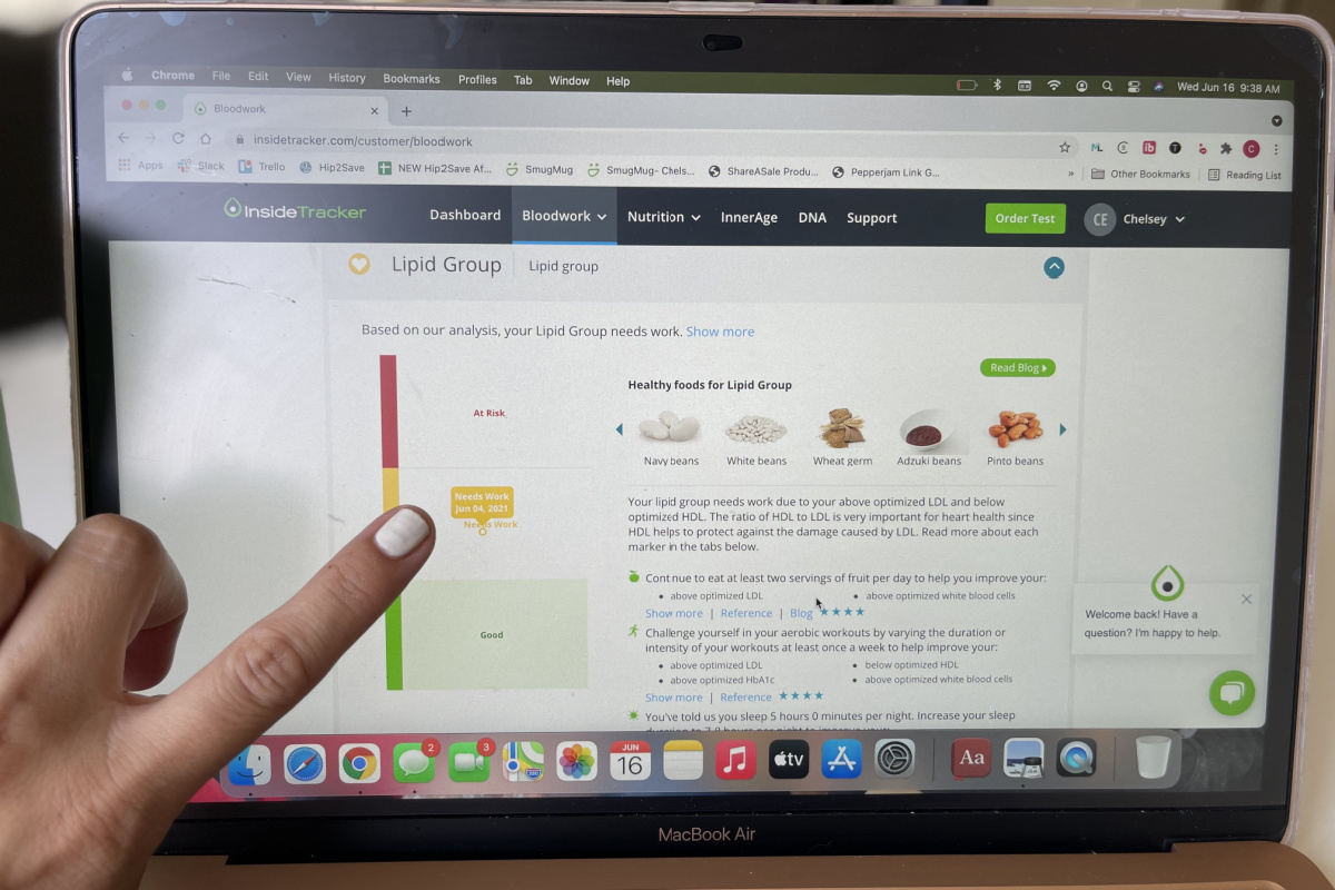 finger pointing to tab test results on laptop screen
