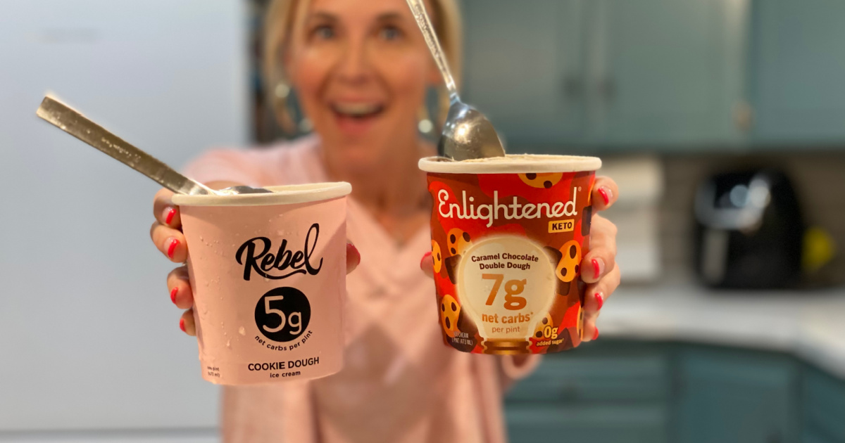 woman holding two different pints of keto ice cream