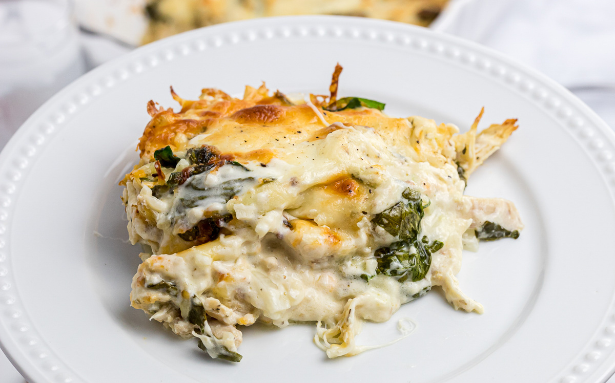 a plat of low carb chicken alfredo bake, a keto chicken alfredo casserole dish