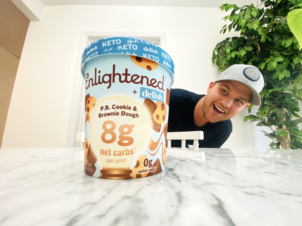 man looking at Enlightened keto collection ice cream