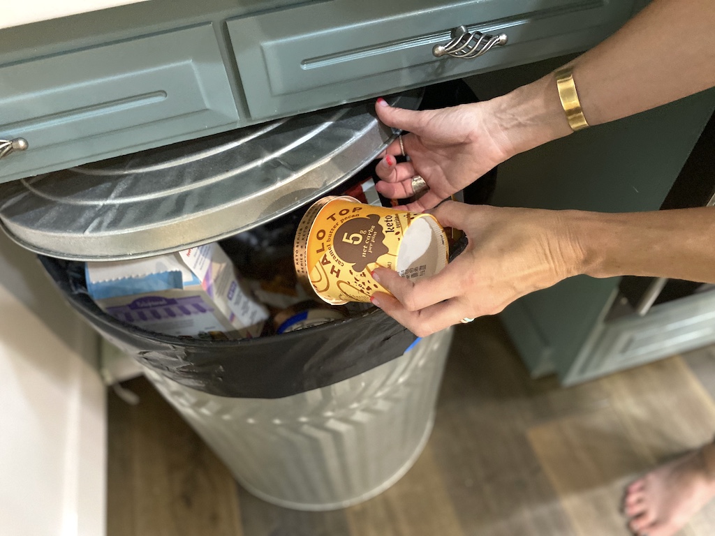 Throwing Halo Top ice cream in the trash can 