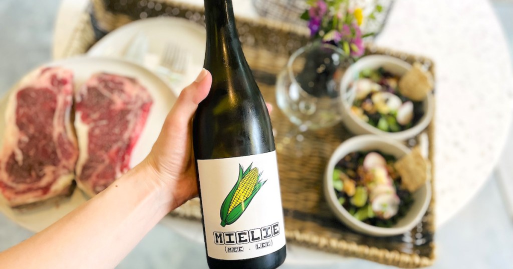 hand holding a bottle of keto wine