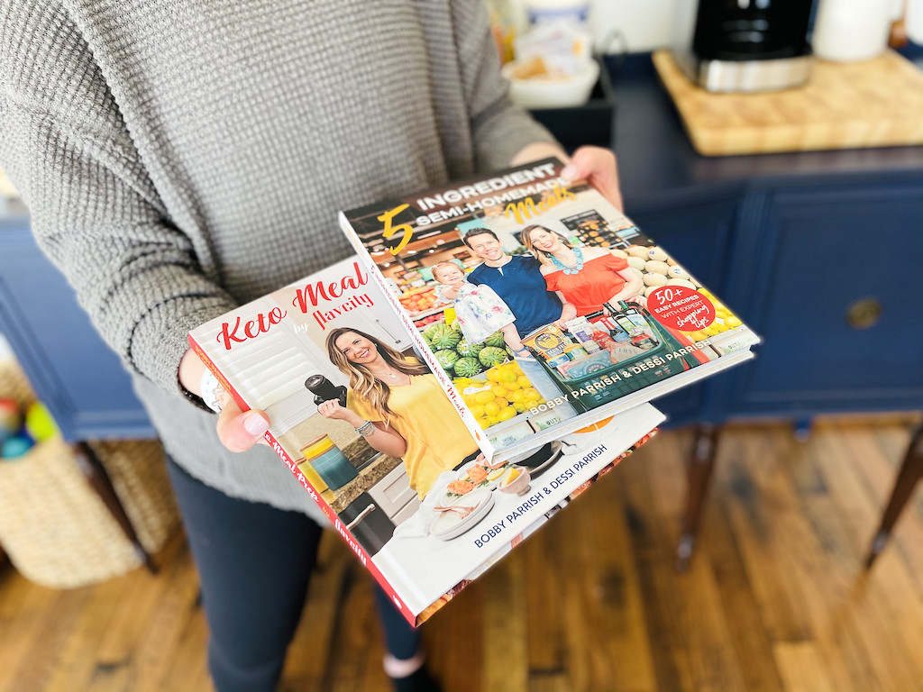 holding FlavCity keto cookbooks 