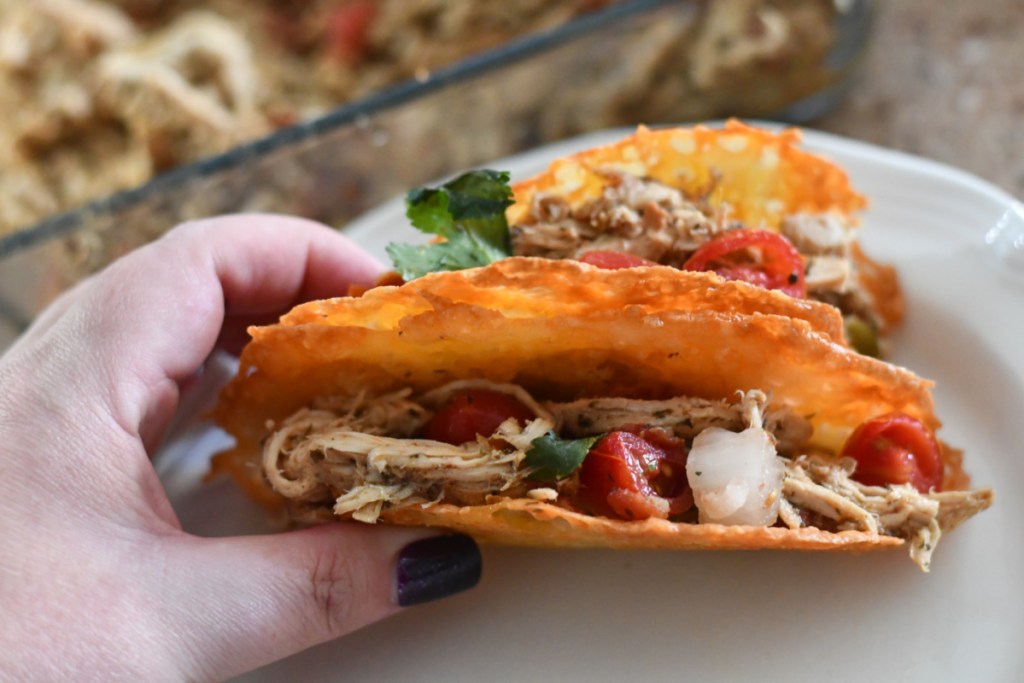 keto tacos made with shredded chicken and served in low carb cheese shells
