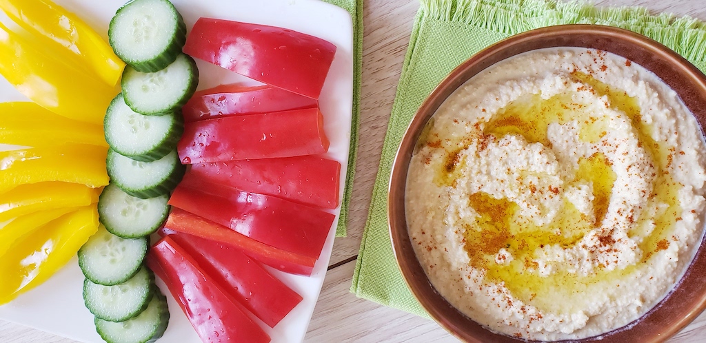 veggies with bowl of keto hummus 