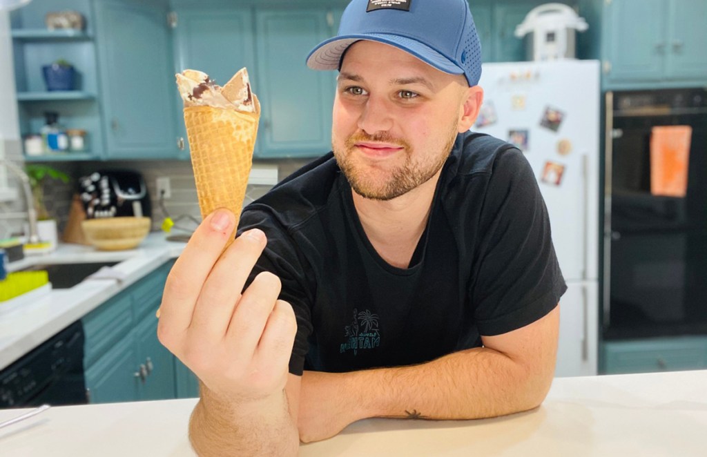 man holding ice cream cone