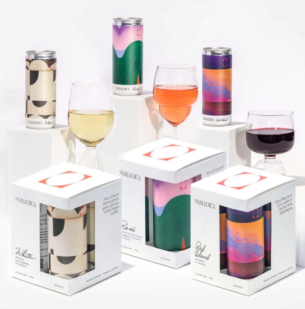 various styles of canned wines set up on white background